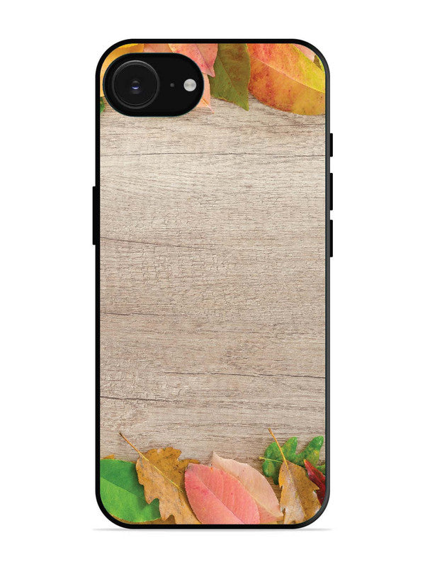 iPhone 16e Autumn Leafs On Wooden Table